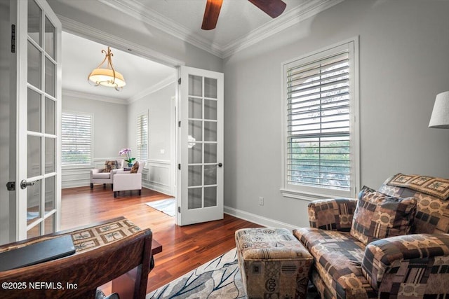 sitting room featuring ornamental molding, hardwood / wood-style floors, ceiling fan, and french doors