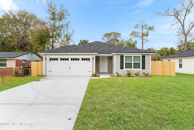 ranch-style home with a garage and a front lawn