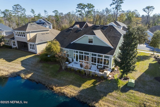 bird's eye view with a water view