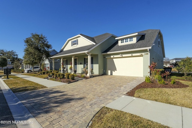 view of front of home with a garage and covered porch