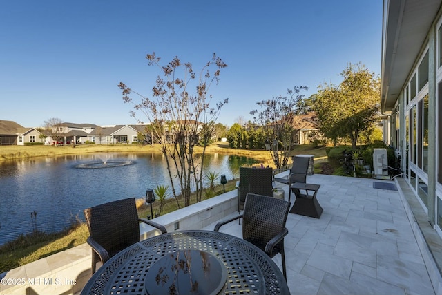 view of patio featuring a water view