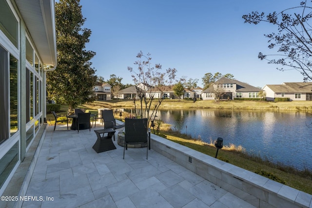 view of patio / terrace featuring a water view