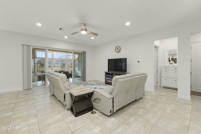 living room with light tile patterned floors and ceiling fan