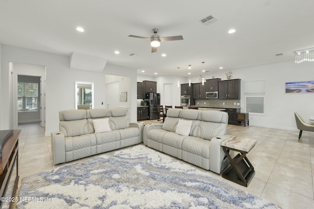 tiled living room featuring ceiling fan