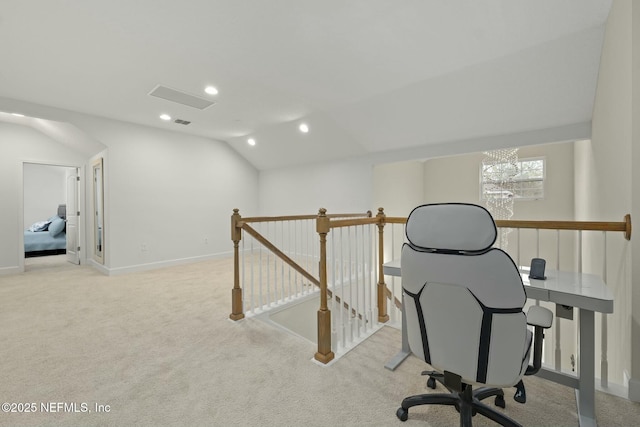 home office featuring lofted ceiling and light carpet