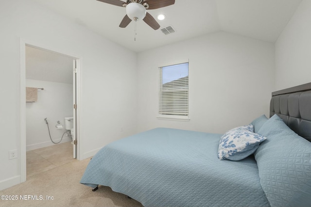 carpeted bedroom with ceiling fan and vaulted ceiling