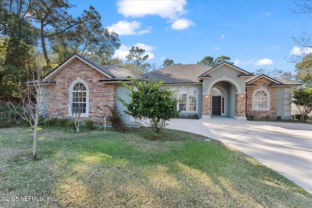 ranch-style house featuring a front lawn