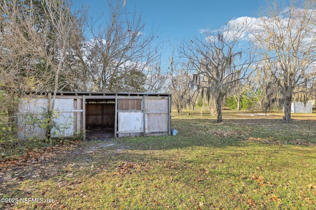 view of outdoor structure with a lawn