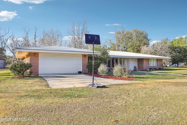 ranch-style house with a garage and a front yard