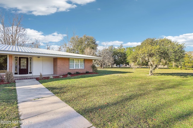 view of front of property with a front lawn