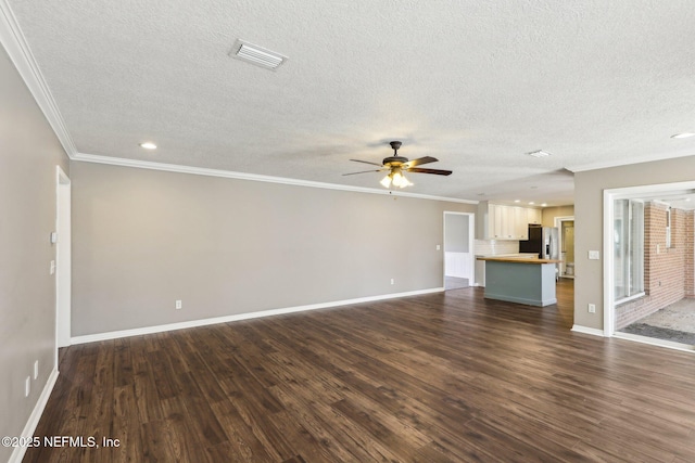 unfurnished living room with crown molding, dark hardwood / wood-style floors, a textured ceiling, and ceiling fan