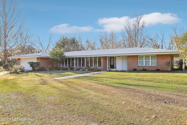 ranch-style house with a garage and a front lawn