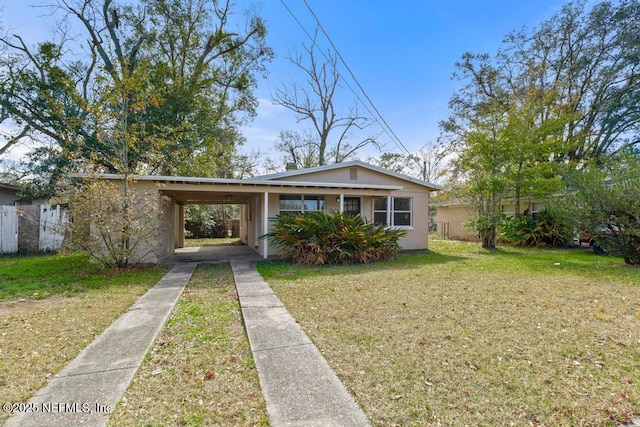 bungalow-style house with a carport and a front yard