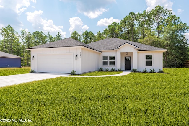 view of front facade featuring a garage and a front lawn