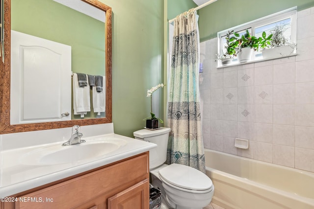 full bathroom with vanity, shower / bath combination with curtain, and toilet