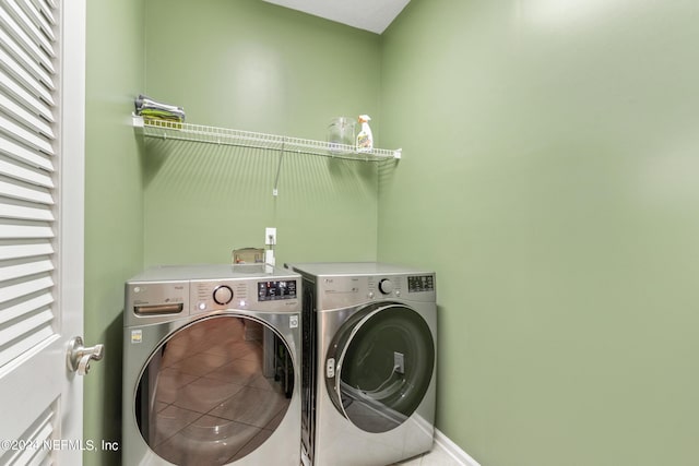 laundry room featuring washing machine and clothes dryer