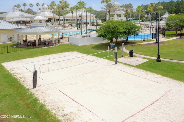 surrounding community featuring a gazebo, volleyball court, and a lawn