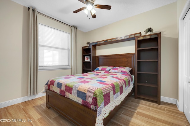 bedroom featuring ceiling fan and light wood-type flooring