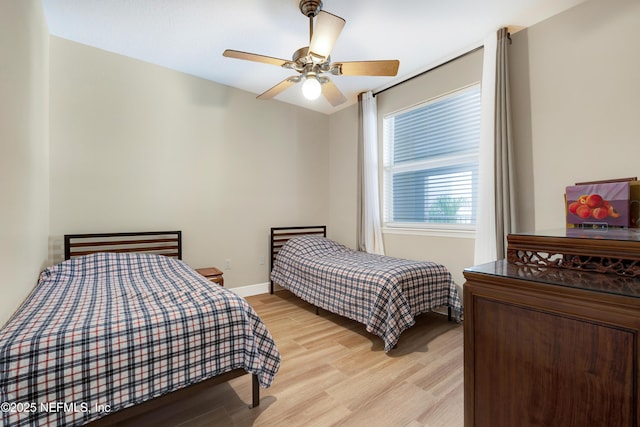 bedroom featuring light hardwood / wood-style floors and ceiling fan