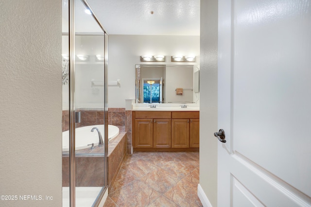 bathroom featuring vanity and plus walk in shower