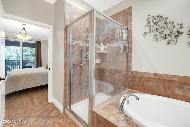 bathroom featuring independent shower and bath and ornamental molding