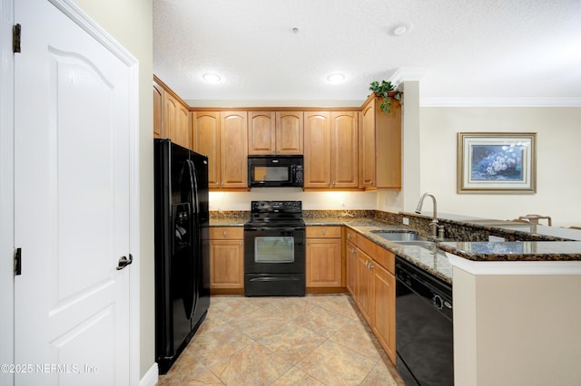 kitchen featuring black appliances, sink, dark stone countertops, kitchen peninsula, and a textured ceiling