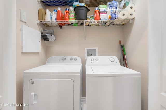 laundry area with independent washer and dryer