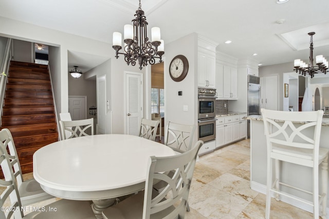 dining area with an inviting chandelier