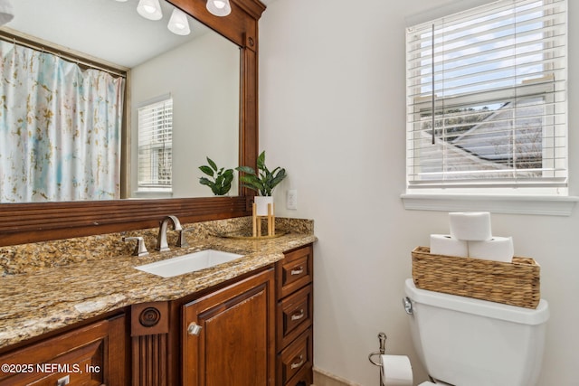 bathroom with vanity and toilet