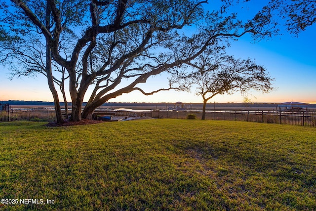 yard at dusk with a rural view