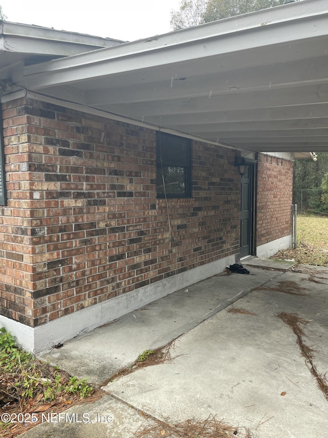 view of home's exterior with a carport