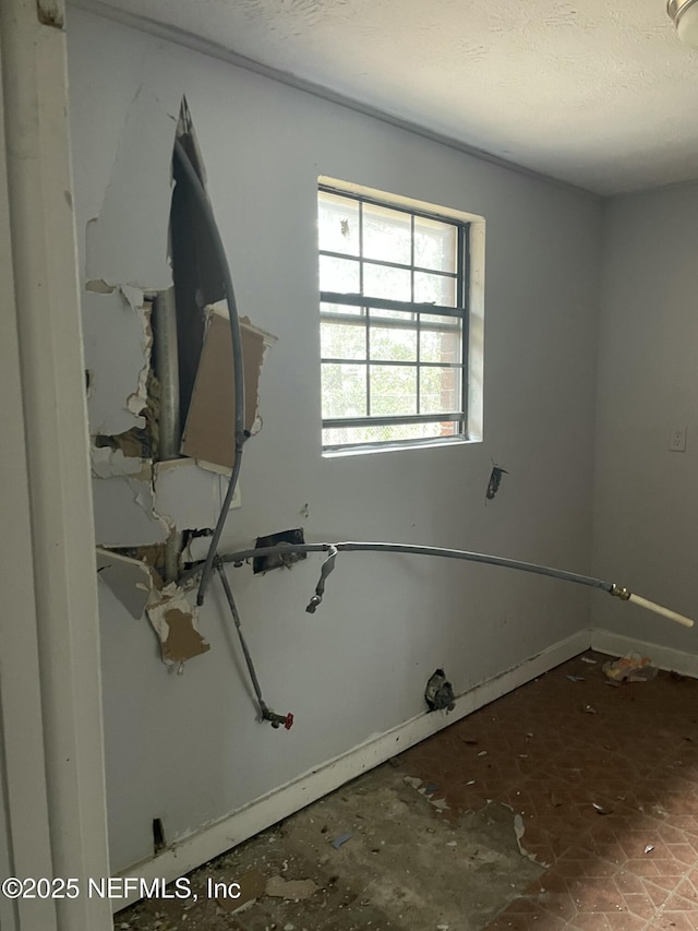 interior space featuring a textured ceiling