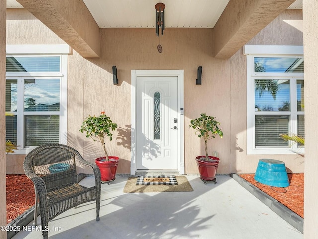 doorway to property with a patio