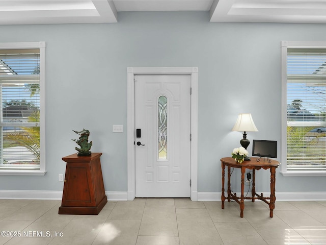 tiled entrance foyer featuring a wealth of natural light