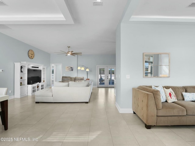 living room featuring light tile patterned flooring, ceiling fan, and french doors