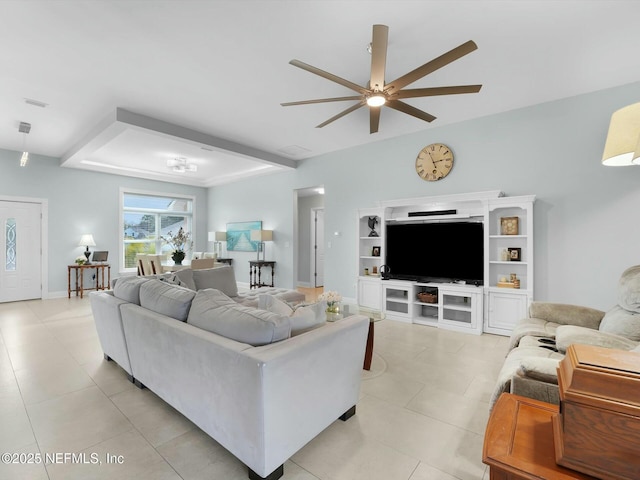 living room with light tile patterned floors and ceiling fan