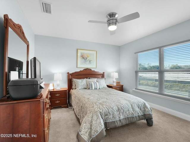 bedroom featuring ceiling fan and light colored carpet