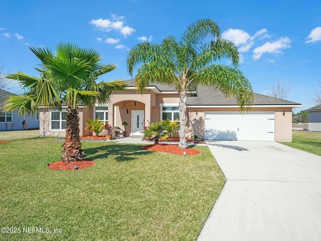 view of front of property with a garage and a front lawn