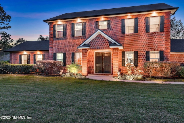 view of front of property with a yard