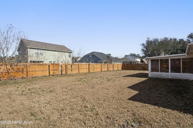 view of yard with a sunroom