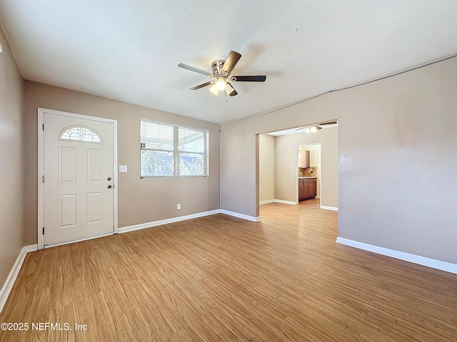 entryway featuring ceiling fan and light wood-type flooring