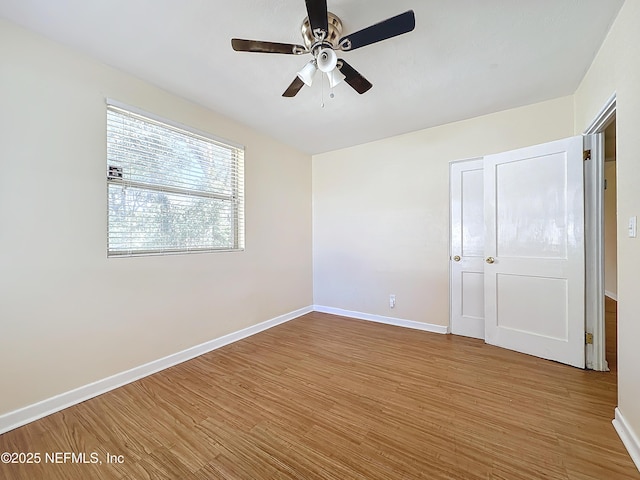 unfurnished bedroom with wood-type flooring and ceiling fan