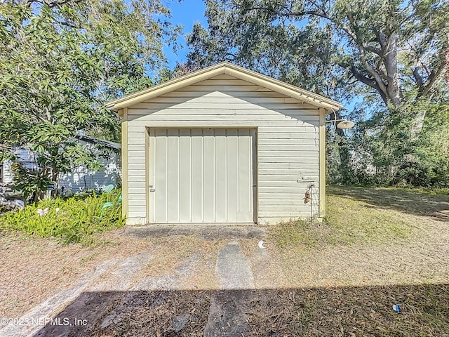 view of outbuilding featuring a garage