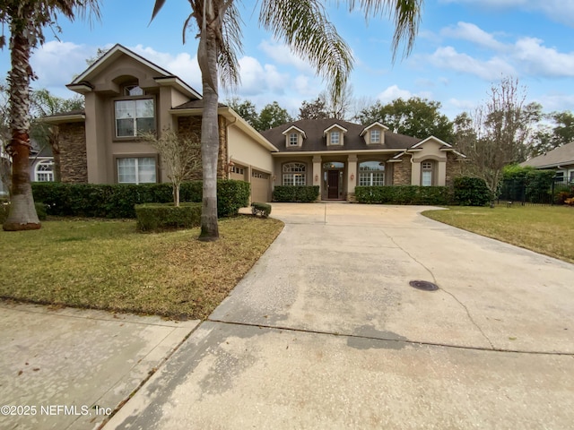 view of front of property with a garage and a front yard