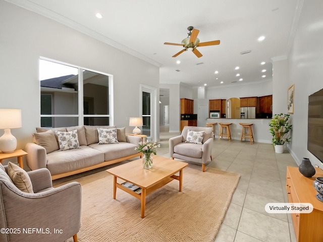 living room featuring light tile patterned flooring, ceiling fan, and crown molding