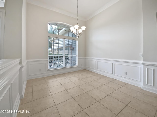 unfurnished dining area featuring an inviting chandelier, light tile patterned floors, and crown molding