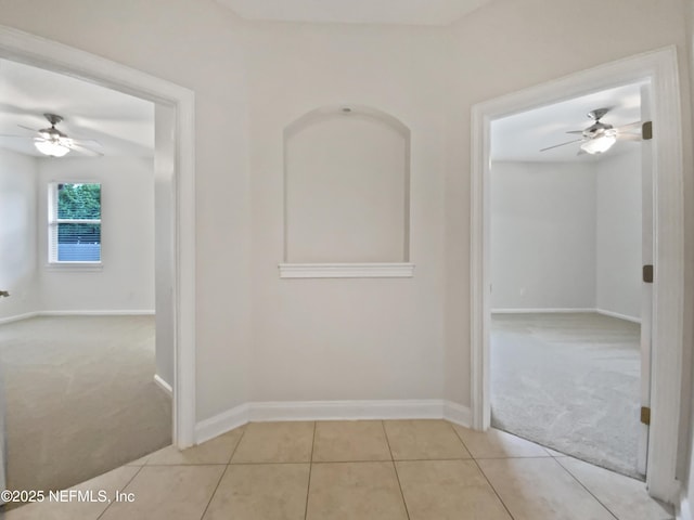 corridor with light tile patterned flooring