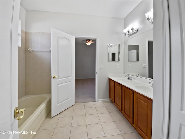 bathroom featuring ceiling fan, tile patterned floors, vanity, and a textured ceiling