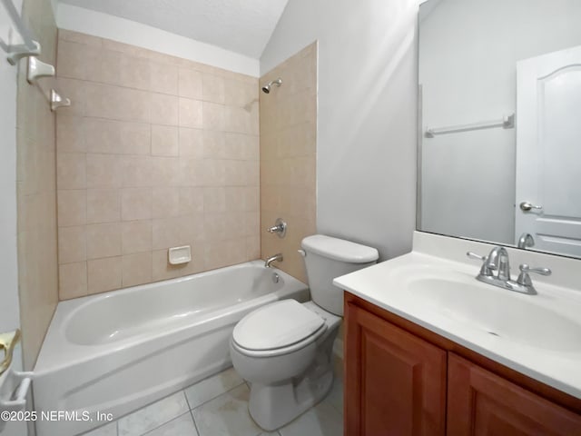 full bathroom with vaulted ceiling, tiled shower / bath combo, vanity, toilet, and tile patterned floors