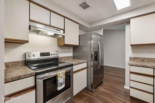 kitchen with white cabinetry, appliances with stainless steel finishes, dark hardwood / wood-style floors, and a textured ceiling